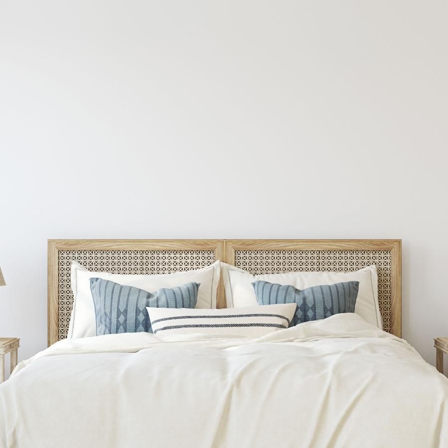 a bed with a white bed spread
